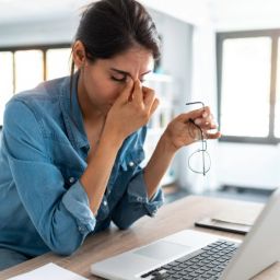 stressed woman foreclosure scam