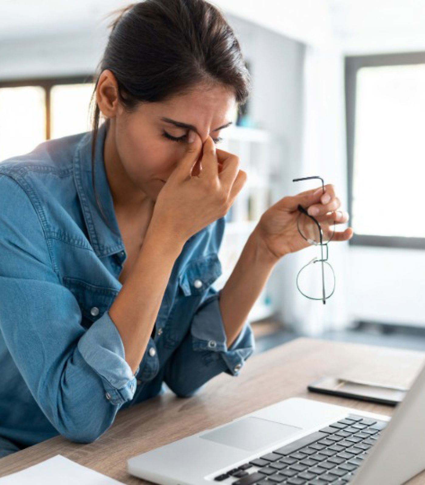 stressed woman foreclosure scam