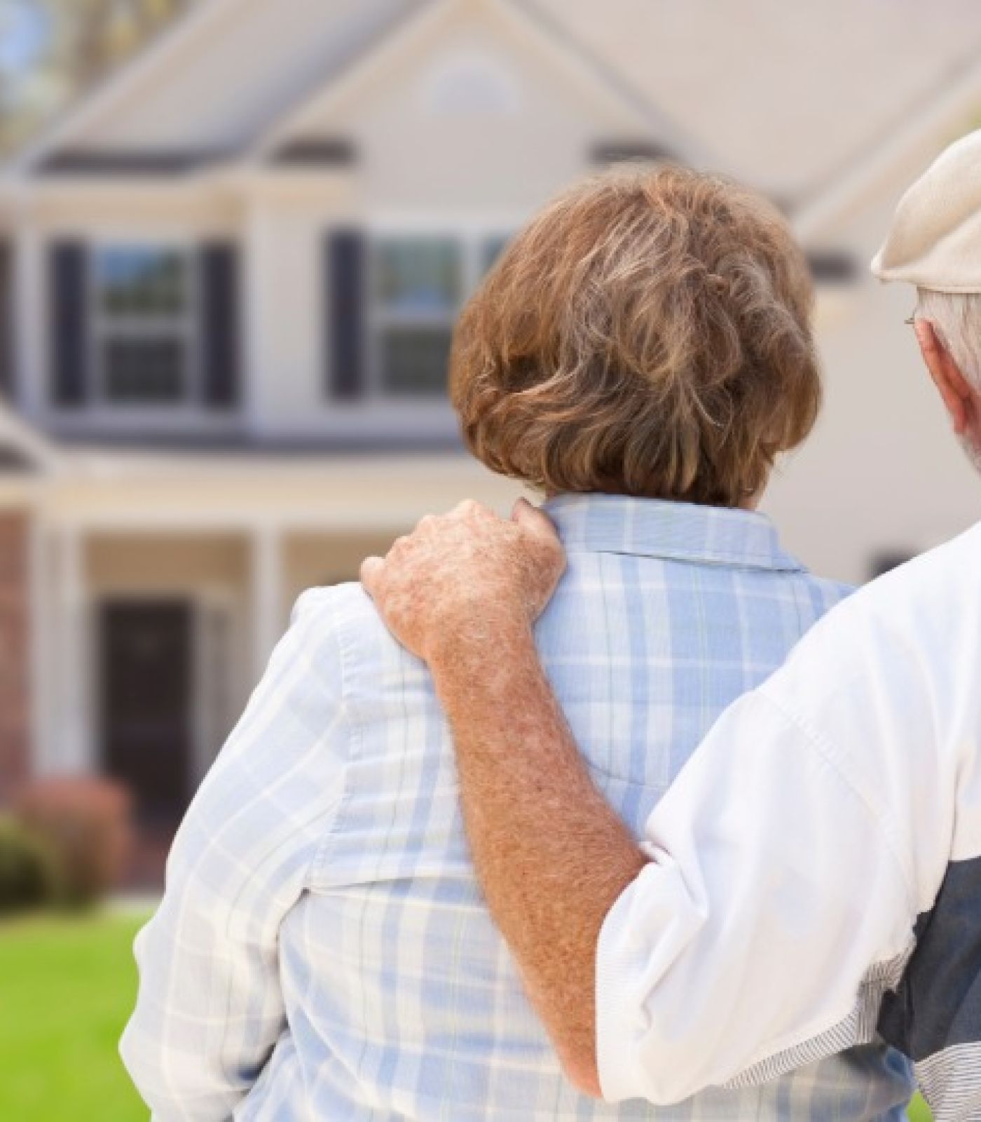An older New England couple looks at their home while weighing whether a loan modification can stop the foreclosure sale."
